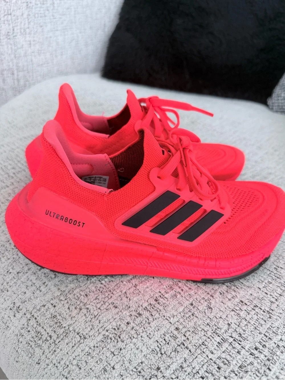 adidas red orange Ultraboost Running Sneakers.